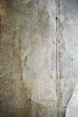 Metal background with traces of old age, traces of iron nails.の写真素材