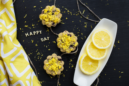 lemon cupcakes with colorful cloth - inscription happy dayの写真素材