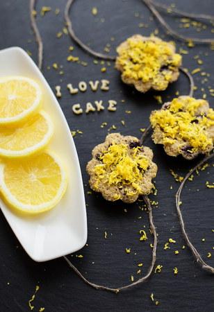 lemon cupcakes on a black background with lemon zest, inscription I love cake, close-upの写真素材