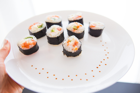 Delicious fresh sushi on a white plate, closeup. View from aboveの写真素材