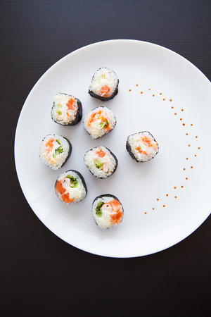 Delicious fresh sushi on a white plate, close-upの写真素材