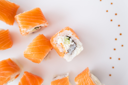 Sushi roll with salmon, philadelphia on a white plate, top view. Close-upの写真素材