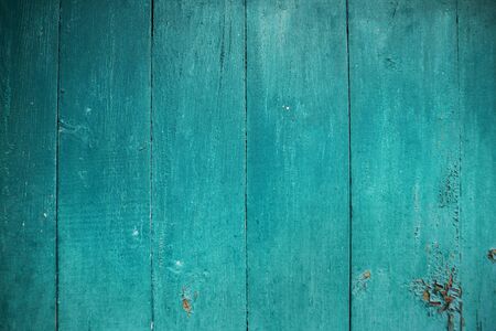 Shabby and very old wooden fence-color aquamarine.の写真素材