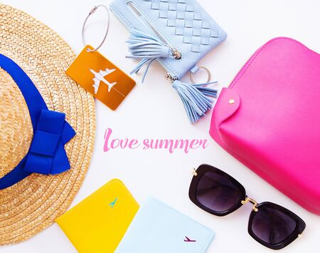 Preparation for vacation - hat, glasses, passport, cosmetic bag, purse Inscription-love summerの写真素材