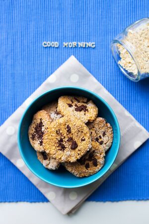 Oatmeal Cookies in blue plate that says good morning.の写真素材