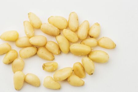 Cedar Pine nuts on a white background.の写真素材
