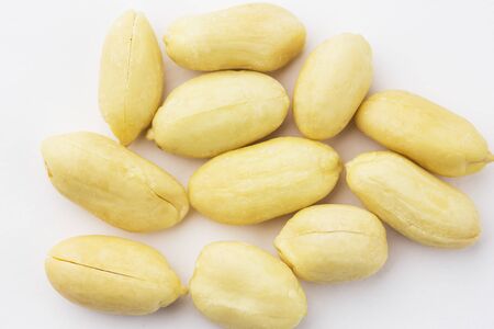 Peeled peanuts isolated on white background, close-up.の写真素材