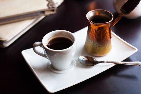 beautiful coffee house in an interesting cozy design-on the table a candle, coffee and turka.の写真素材