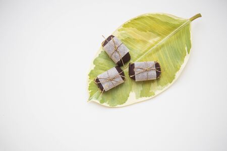 useful homemade sweets from different types of nuts decorated with kraft paper.の写真素材