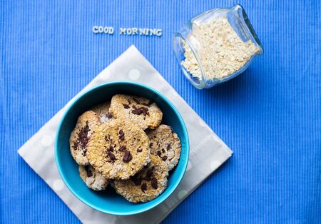 Oatmeal Cookies in blue plate that says good morning.の写真素材
