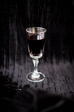nice glass of red wine on a black background Velvet.の写真素材
