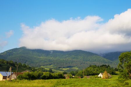 Haystack summer in the beautiful village Ukrainian Carpathiansの写真素材