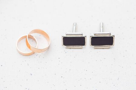 Engagement rings, gold rings and cufflinks taken close.