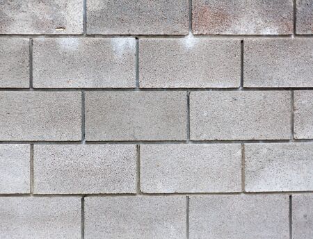Modern grey brick wall for background or textureの写真素材