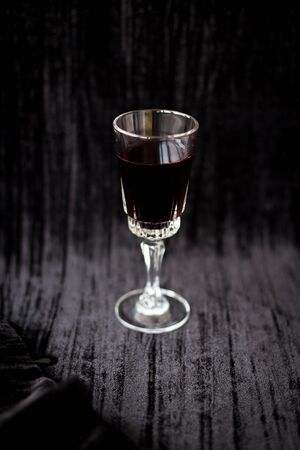nice glass of red wine on a black background Velvet.の写真素材