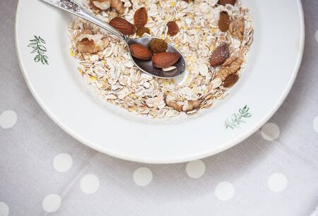 Oatmeal in bowl with nuts, useful foodの写真素材