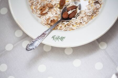 Oatmeal in bowl with nuts, useful foodの写真素材