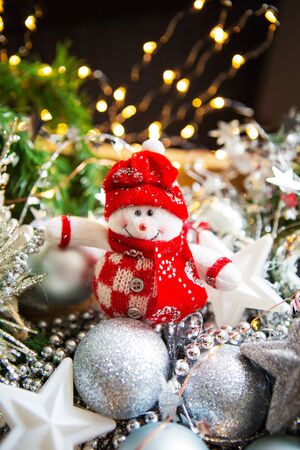 Christmas background. Beautiful bokeh in the background. Snowman close-upの写真素材