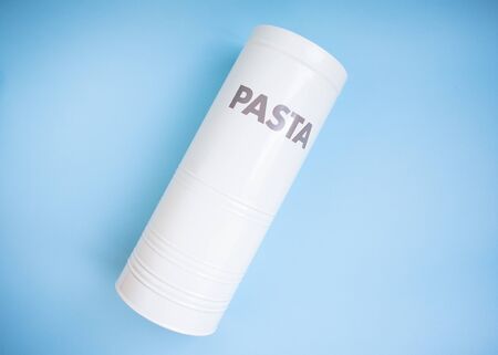 White tin can for pasta. Spaghetti in a tin can with the inscription Pasta, Italian dinner. Place for an inscription.の写真素材