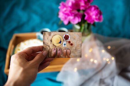 Beautiful morning Vanilla cheesecake, coffee, blue cups, pink peonies in a glass vaseの写真素材
