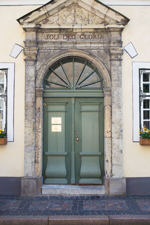 Very beautiful green old doors in the old city of Riga in Latviaの写真素材