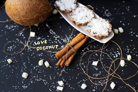 coconut muffins on a black background with words like candied fruits and coconuts, close-upの写真素材