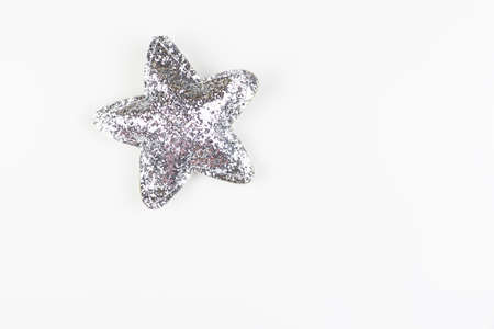 New Year's beautiful star in sparkles and sequins. Isolated on white background, close-upの写真素材