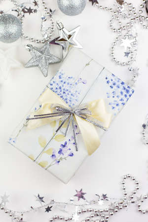 Very nice festive decor. Christmas gift box with festive decor in silver tones.の写真素材