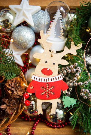 Christmas background. Beautiful card with a wooden deer. Close-up.の写真素材