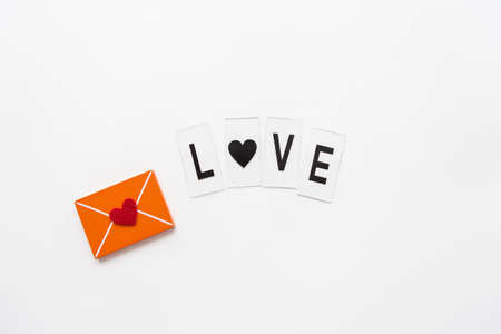 Love letter, small wooden orange envelope. Love letteringの写真素材