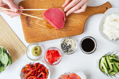 Close-up of a juicy delicious grilled tuna steak on a bright plate. Delicious and healthy food, proper nutritionの写真素材