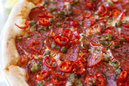 Pepperoni pizza with salami and jalapeno chili. Very spicy and delicious pizzaの写真素材