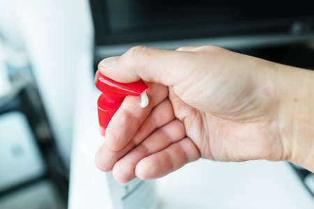 A man takes a cream for irritation and dryness of the skin. Maximum hydration and softness of the...