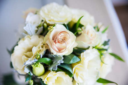 beautiful bridal bouquet lying on sofaの写真素材