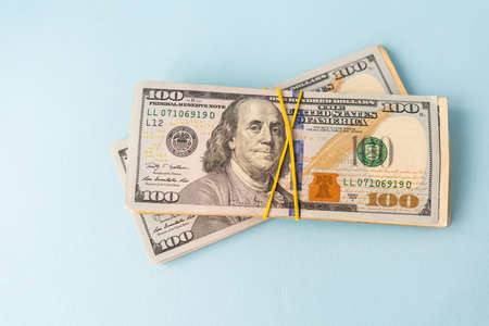 International banknotes - dollars, euros tied with an elastic band. Place for an inscription. The concept of currency transactions, loans, exchange, gamblingの写真素材