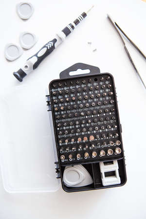 Set of screwdriver bits. Metal bits and adapters for screwdriver boxes. A set of tools for home useの写真素材