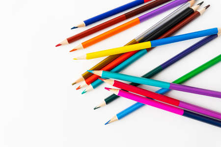 Close-up macro photography of scattered colored pencils for drawing. Place for an inscriptionの写真素材