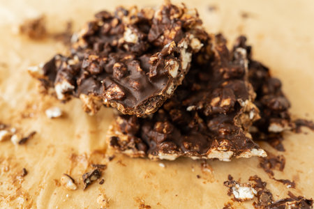 Close-up texture of peanut butter, puffed rice and chocolate, very tasty DIY dessert, dessert slices...