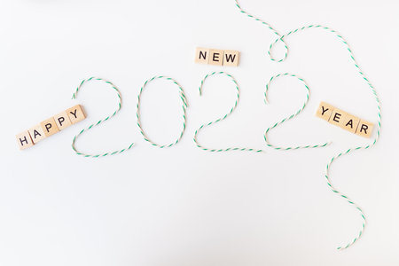 Holiday concept for Christmas and New Year 2022. Layout of various Christmas attributes - striped threads for packaging. View from aboveの写真素材