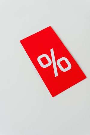 Black friday sale or discount banner. Red tag with percentage, discount on a white background. Template for promoting advertising in social networks. Vertical photoの写真素材