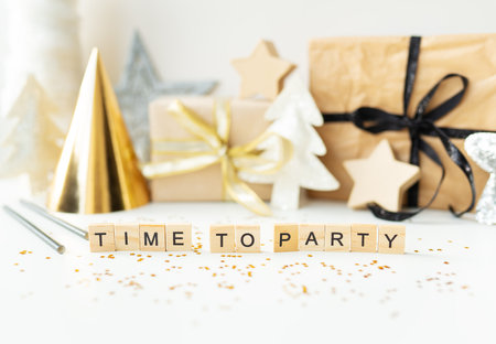 Christmas party time - confetti, gifts, tree, stars, glitter, ribbon. Party time lettering New year 2023-2024の写真素材