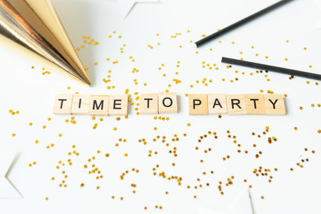 Christmas party time - confetti, gifts, tree, stars, glitter, ribbon. Party time lettering New year 2023-2024の写真素材