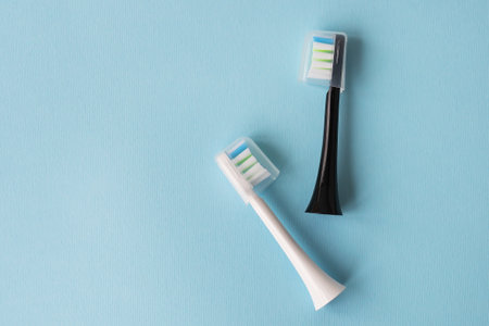 Modern electric toothbrush on a blue background. Hygiene concept for daily oral careの写真素材