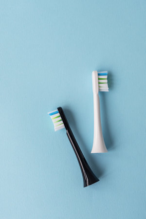 Modern electric toothbrush on a blue background. Hygiene concept for daily oral careの写真素材