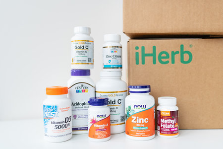Lviv, Ukraine - December 17, 2022: Unboxing boh delivered from iherb online store. Package with vitamins and supplements to support healthのeditorial素材