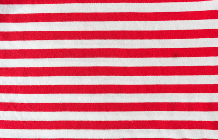 Fabric sample in red white horizontal stripe with worked. background textureの写真素材