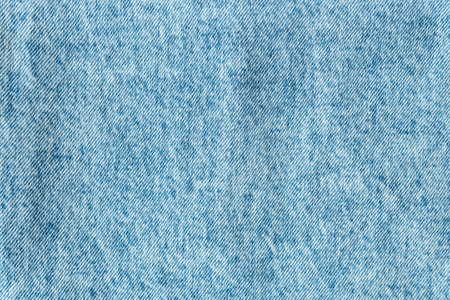 Denim structure, classic blue denim fabric, clear fabric structure, place for text. Background, texture. Selective focus, noiseの写真素材
