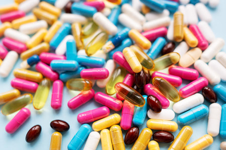 Lots of colorful pills and capsules for different symptoms. concept of health and medicineの写真素材