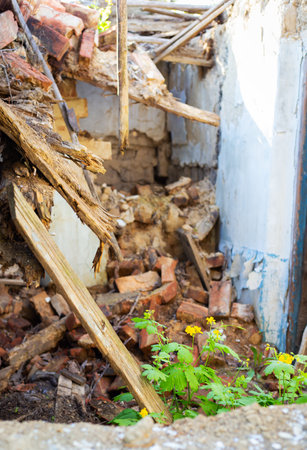 Old abandoned one-story house in disrepair. collapsed wallsの写真素材