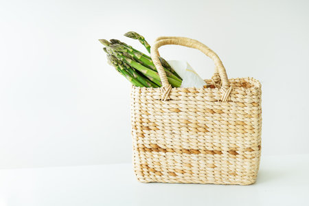 Fresh sliced asparagus on a white background. view from above. Vegan and very healthy healthy food. Farmer's harvest, going to the marketの写真素材